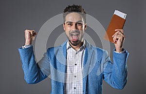 Happy smiling man holding tickets in hand