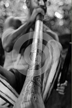 Yirrganydji Aboriginal man play Aboriginal music on didgeridoo