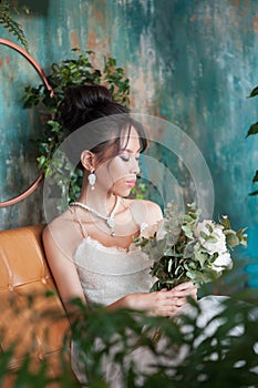 Yiung beautiful asian bride with flowers