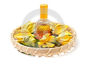Ylang-Ylang essential oil with flowers