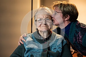38 yo daughter in law kissing her 85 yo mother, Tienen, Belgium photo