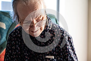 84 yo white grandmother sitting in a wheelchair, Tienen, Belgium photo