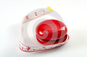 Yo-yo dieting, yo yo effect or weight cycling concept theme with a yoyo toy wrapped in tape measure or measuring tape symbolizing