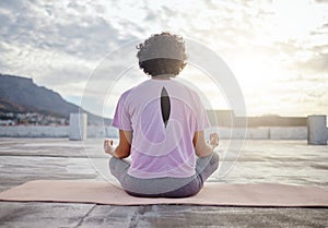 Yoga, back view and woman in meditation on roof training to meditate body and spiritual mind in Cape Town city. Fitness