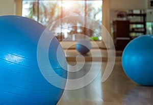 Yoga ball and map yoga in fitness room, select focus.