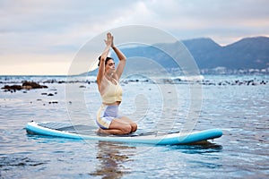 Yoga, beach and woman in the water for meditation, training of mind and spiritual wellness. Peace, relax and girl with