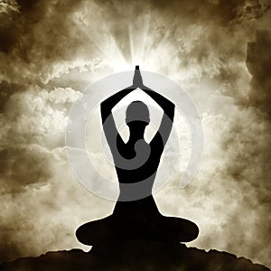 Yoga Body Pose Silhouette Exercising on Sunset Sky Background