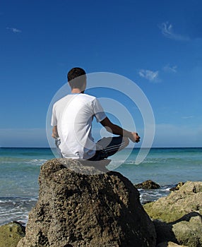 Yoga boy - beach meditation