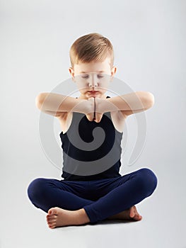 Yoga boy.child in the lotus position.children meditation and relaxation