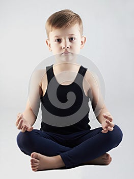 Yoga boy.child in the lotus position.children meditation and relaxation