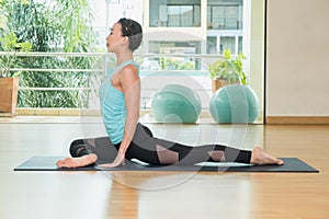 Yoga class studio, asian woman master doing Half Pigeon pose, Heal