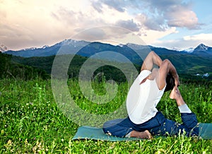 Yoga Eka Pada Rajakapotasana pose in mountains