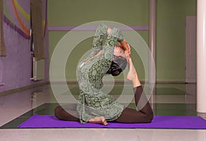 Yoga female presenting yoga in fitness class