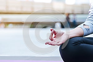 Yoga fitness lifestyle healthy woman relaxation doing a meditation. Yoga meditating outdoor with zen on sitting position. Young