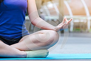 Yoga fitness lifestyle healthy woman relaxation doing a meditation. Yoga meditating outdoor with zen on sitting position. Young