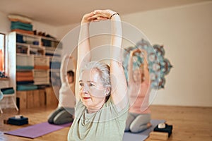 Yoga, fitness and senior woman in studio doing workout, stretching and training in exercise class. Wellness, retirement