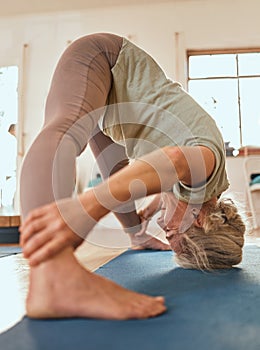 Yoga, flexibility and senior woman on a floor for dolphin pose, wellness and exercise in a living room. Pilates, elderly