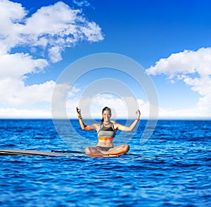 Yoga girl over SUP Stand up Surf board