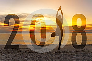 Yoga Happy new year card 2018. Silhouette woman practicing yoga standing as part of Number 2018