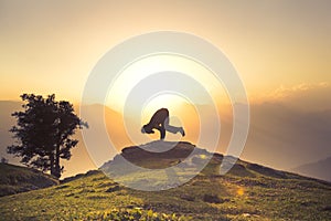 Yoga on a Himalayan mountain during a beautiful sunset