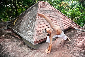 Yoga horizon pose on the roof