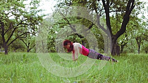 Yoga instructor girl showing extended side angle pose to downward facing dog, deservedly one of yogas most widely