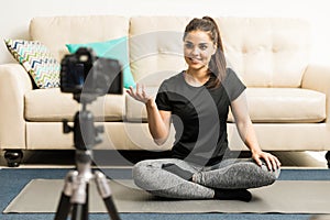 Yoga instructor recording a video