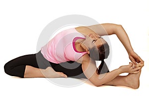 Yoga instructor in seated side stretch pose Parsva