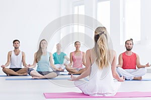 Yoga instructor in studio photo