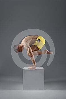 Yoga keeps balanc on hands in difficult pose