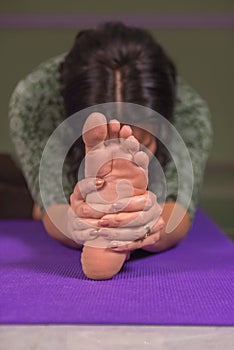 Yoga learner shows yoga exercises