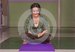 Yoga learner works out yoga stretches in a studio