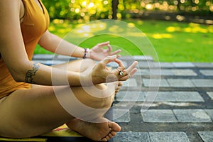 Yoga lifestyle. Close up gyan mudra. Lotus pose. Young woman meditating, practicing yoga and pranayama with gyan mudra. Bali