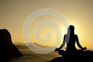 Yoga lotus position silhouette on seaside