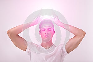 Yoga man in lotus pose with chakra symbols