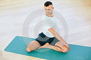 Yoga man practice in a training hall