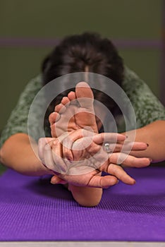 Yoga master teaches yoga lesson in a studio