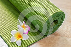 Yoga mat with flowers photo