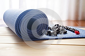 Yoga mat with mala beads photo