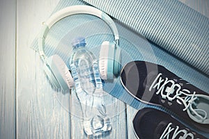 Yoga Mat, sports shoes, water bottle concept of healthy living, healthy eating, sports and diet