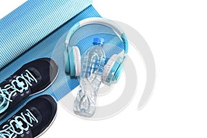 Yoga Mat, sports shoes, water bottle concept of healthy living, healthy eating, sports and diet
