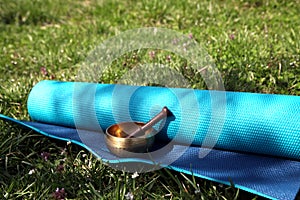 Yoga mat and Tibetan singing bowl meditation items