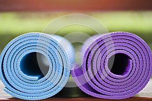 Yoga mats on the table in a garden