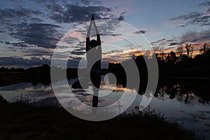 Yoga meditation concept, Man silhouette in sunset