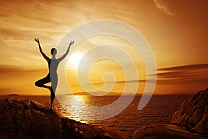 Yoga Meditation Concept, Woman Silhouette Meditating in Nature photo