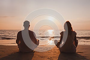 yoga and meditation in Goa, silhouette of man and woman at sunset, India