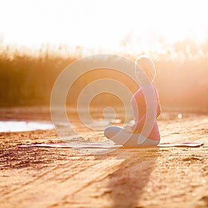 Yoga meditation, woman on sunset