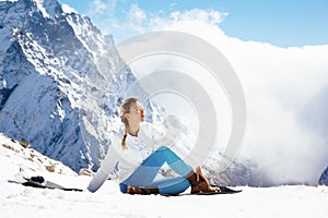 Yoga on mountain in winter