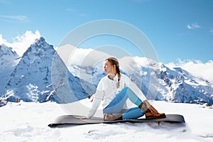 Yoga on mountain in winter