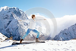 Yoga on mountain in winter